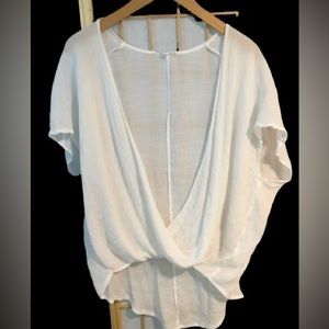 White Gauze Top. Crisscrossfront. Longer in back.